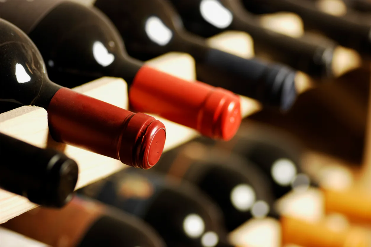 Bottles of wine on a rack.